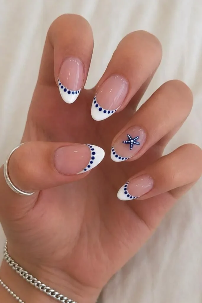Blue White French Tip Press On Nails with starfish and seashell art for summer.