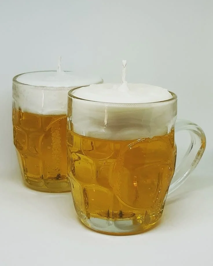 DIY candles made from beer mugs for unique decor and gifts.