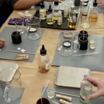Beginners creating scented candles in a Candle Making Workshop in Berlin.