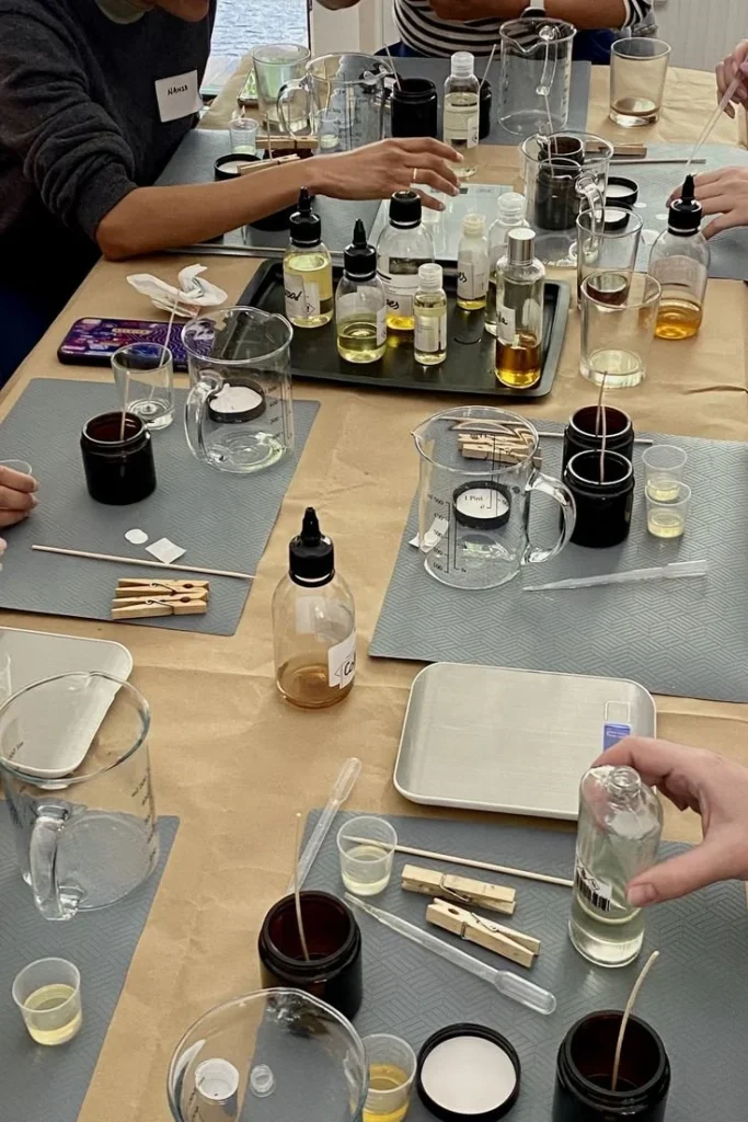 Beginners creating scented candles in a Candle Making Workshop in Berlin.