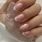 Coquette Bow Nails with mini macaron accents for trendy moms