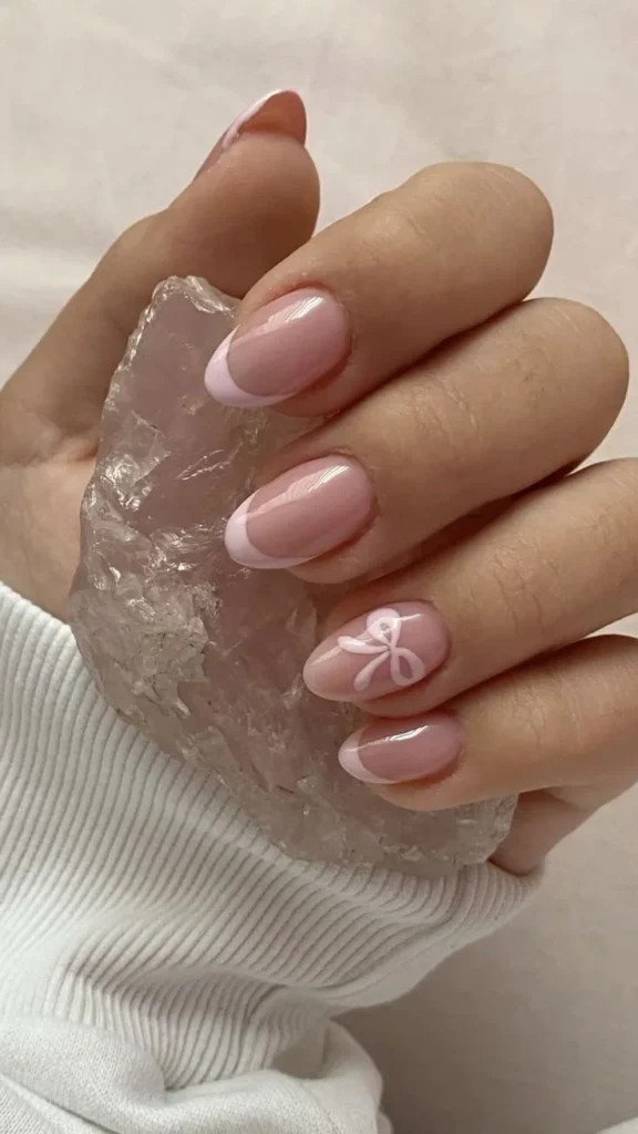 Coquette Bow Nails with mini macaron accents for trendy moms