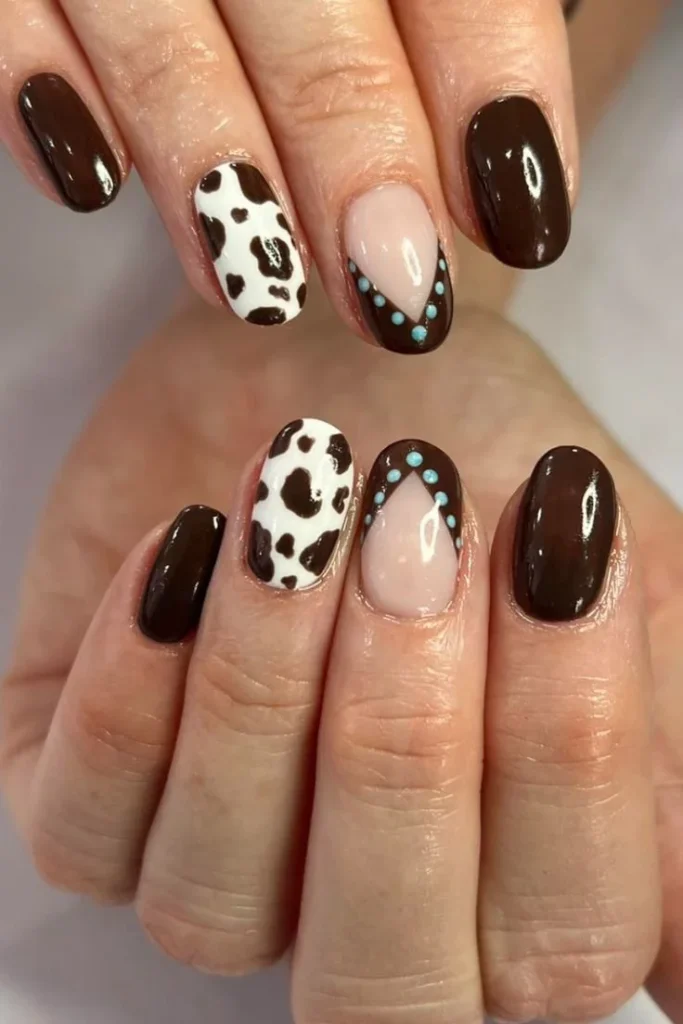 Cowgirl nail art design featuring western themes and unique patterns.