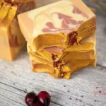 Homemade Cranberry Orange Soap with festive decorations for Christmas crafts