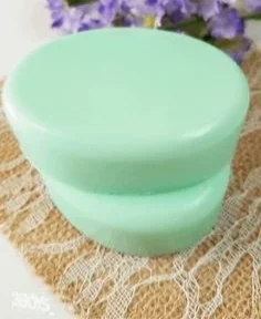 Homemade Cucumber Melon Soap bars on a wooden surface
