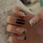 Cute animal nails featuring a short French tip design for busy school moms.