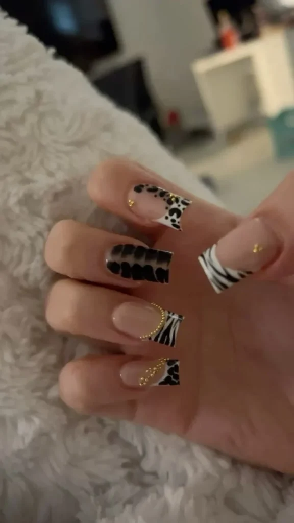 Cute animal nails featuring a short French tip design for busy school moms.