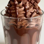 Decadent chocolate dessert layered in a glass bowl, perfect for special occasions.