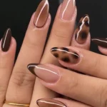 Brown tan press on nails with leopard French tip design in almond shape.