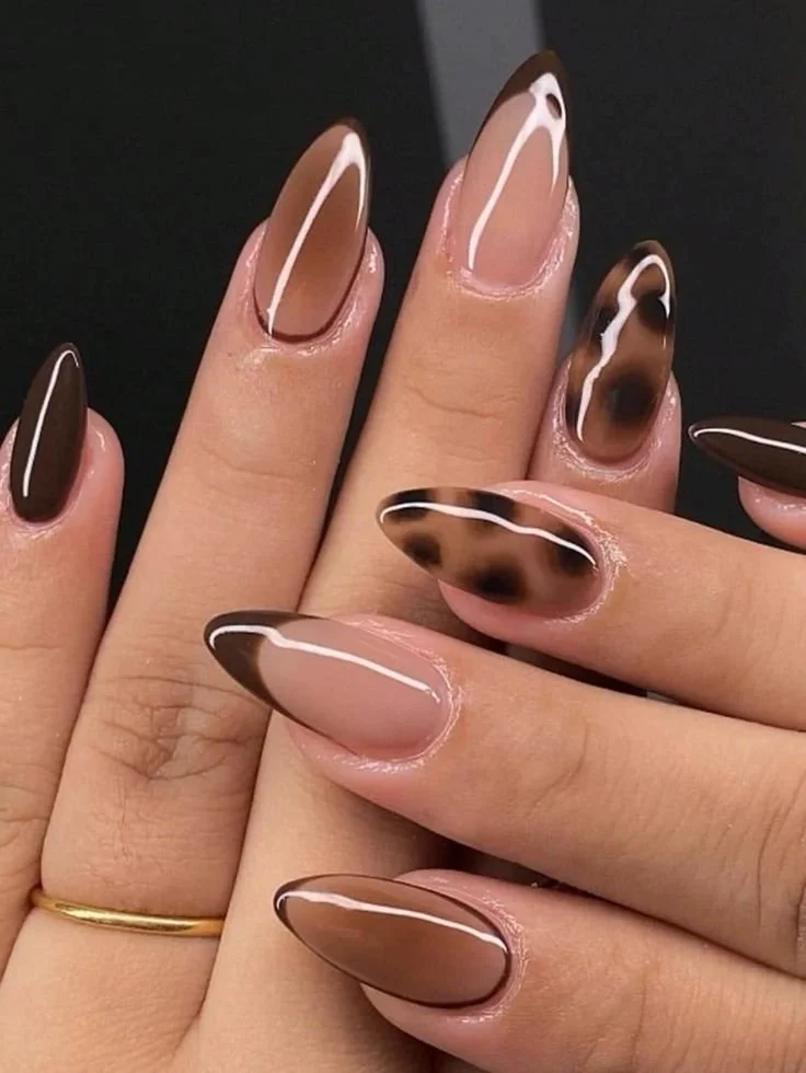 Brown tan press on nails with leopard French tip design in almond shape.