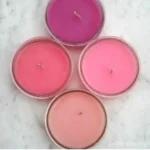 Homemade DIY candle making process with various materials and tools