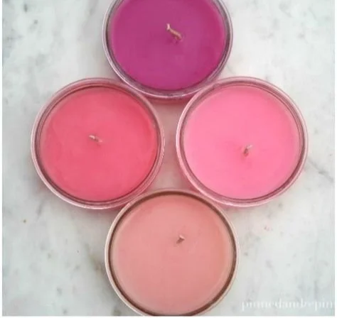 Homemade DIY candle making process with various materials and tools