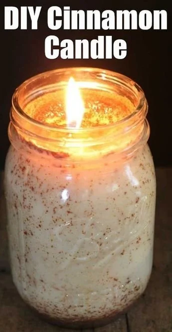 Homemade cinnamon candle lit for a cozy ambiance