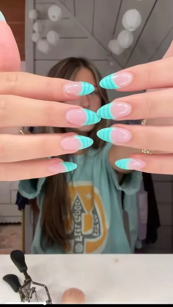 Beautiful teal nail designs with easy blue and white French tips.