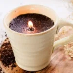 Homemade coffee candles with whole coffee beans for easy DIY decoration.