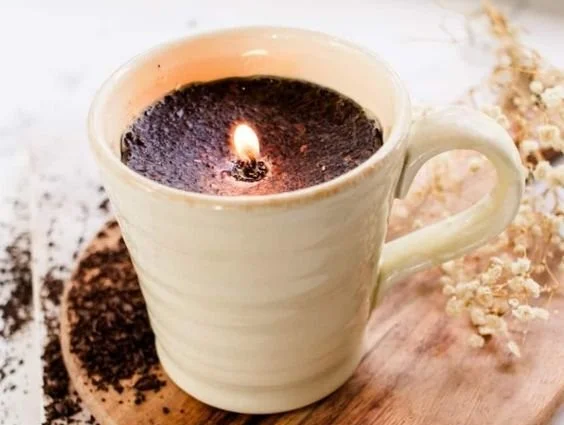 Homemade coffee candles with whole coffee beans for easy DIY decoration.