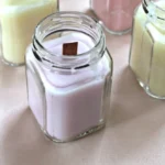 DIY wooden wick candles with wine and sprinkles for a cozy atmosphere.