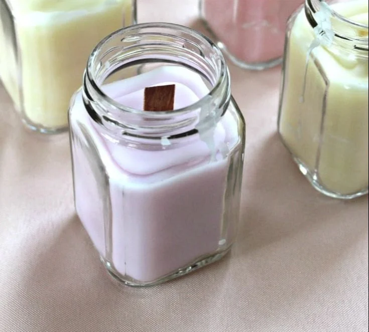 DIY wooden wick candles with wine and sprinkles for a cozy atmosphere.