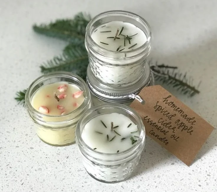 Homemade natural candles in cozy setting, showcasing warm light and relaxation.