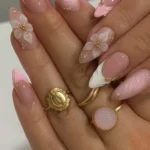 Elegant 3D floral French nails in pink and white almond design
