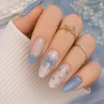 Elegant blue bow nails in soft blue and nude almond design tutorial