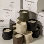 Harriet Allure home fragrance candles in a cozy setting inviting relaxation