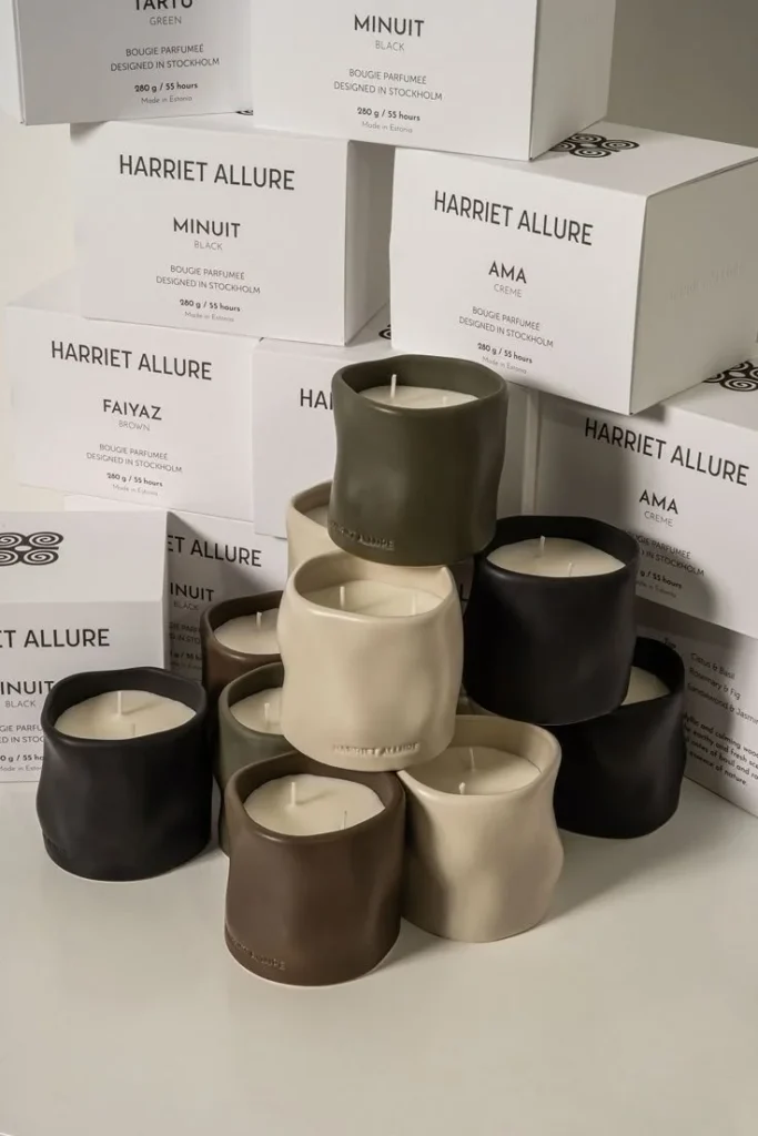 Harriet Allure home fragrance candles in a cozy setting inviting relaxation