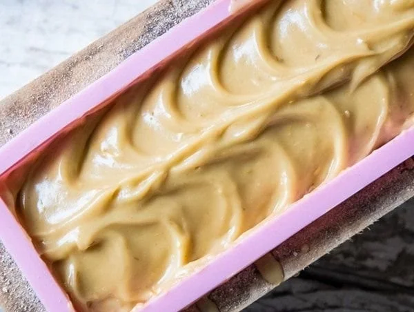 Homemade dandelion soap bars crafted from natural ingredients.