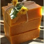 Homemade honey and dandelion soap crafted with natural ingredients for summer refreshment.