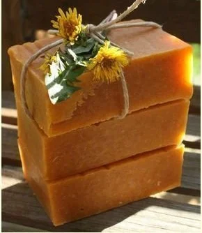 Homemade honey and dandelion soap crafted with natural ingredients for summer refreshment.