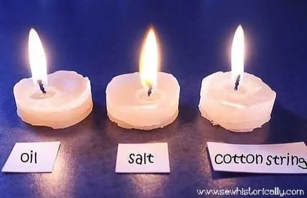 Homemade DIY candle wicks made from cotton string in three different styles.
