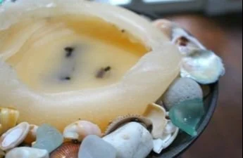 Upcycled candles made from old candle remnants and DIY crafting supplies.