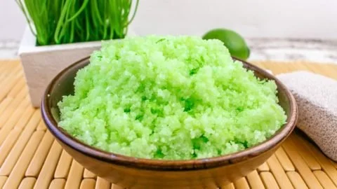 DIY Margarita Salt Scrub ingredients and finished product in a glass jar.