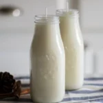 DIY milk jug candles with colorful wax and wicks in a cozy setting.