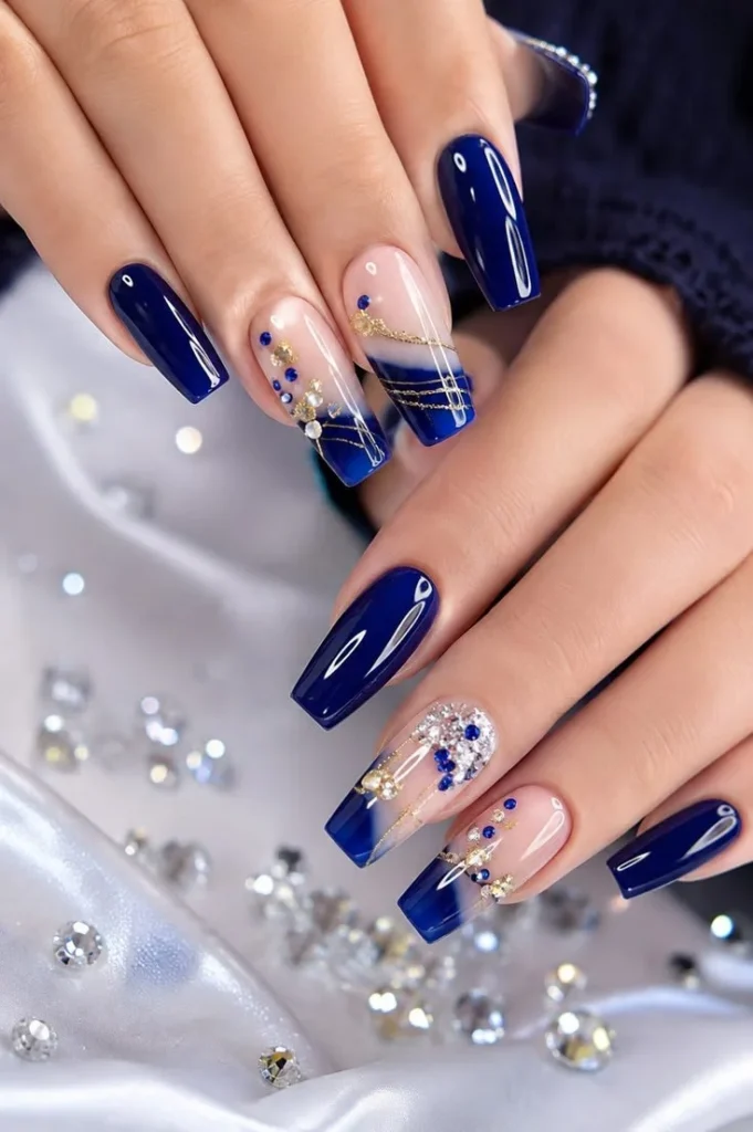 Stylish navy blue and rhinestone press-on nail inspiration design.