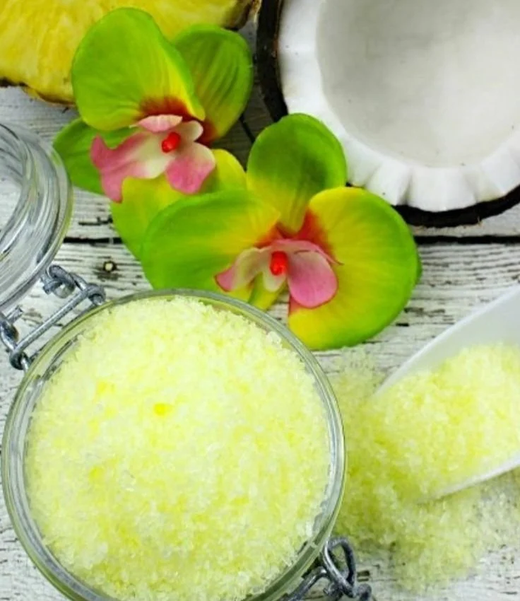 A bowl of Pina Colada Bath Salts with coconut and pineapple ingredients