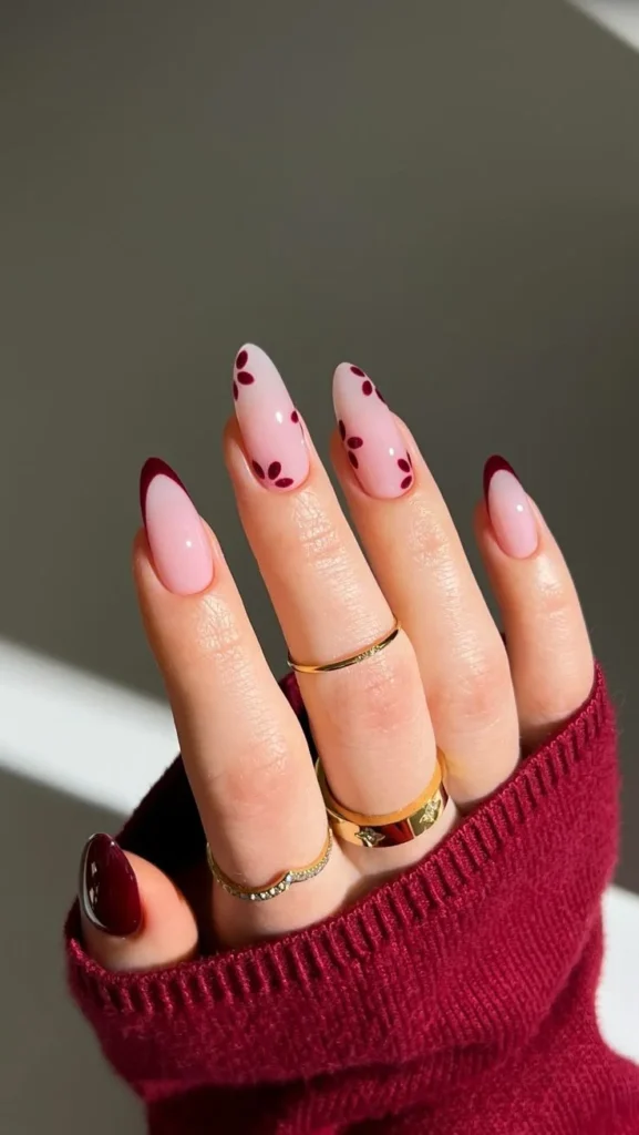 Beautifully designed flower nails in dark cherry shade with floral motifs