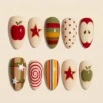 Retro Apple Coquette press on nails with vintage stripes, plaid, and Y2K fruit designs.