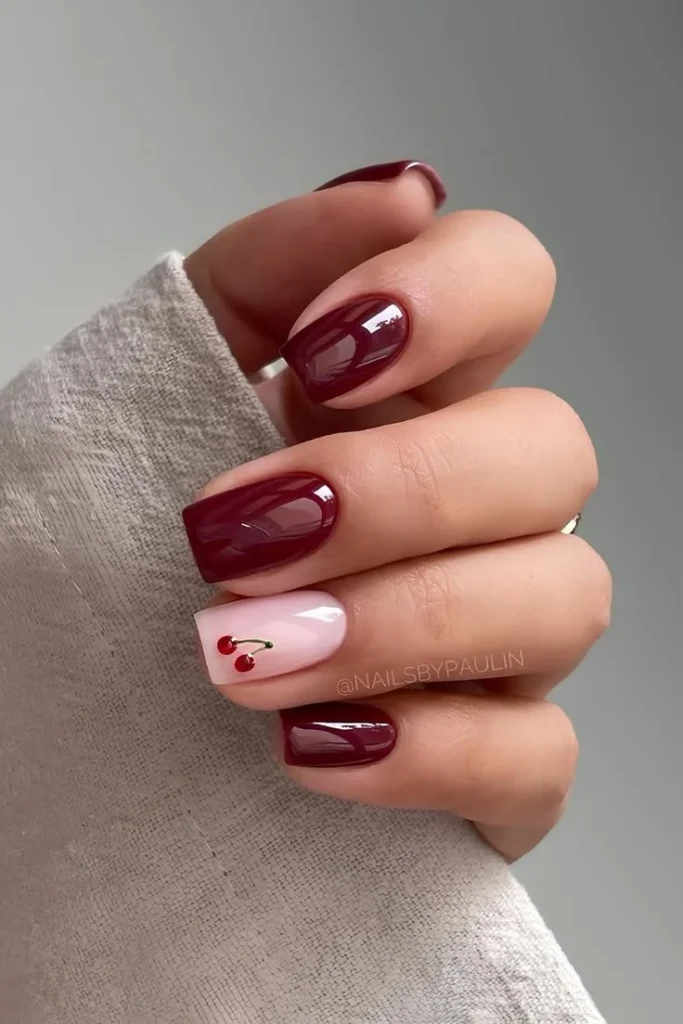 A beautiful display of short pink nails with stunning designs for moms.