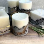 Handcrafted concrete geode candles in various colors for home decoration.