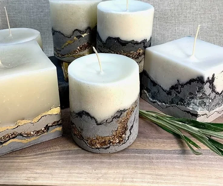 Handcrafted concrete geode candles in various colors for home decoration.