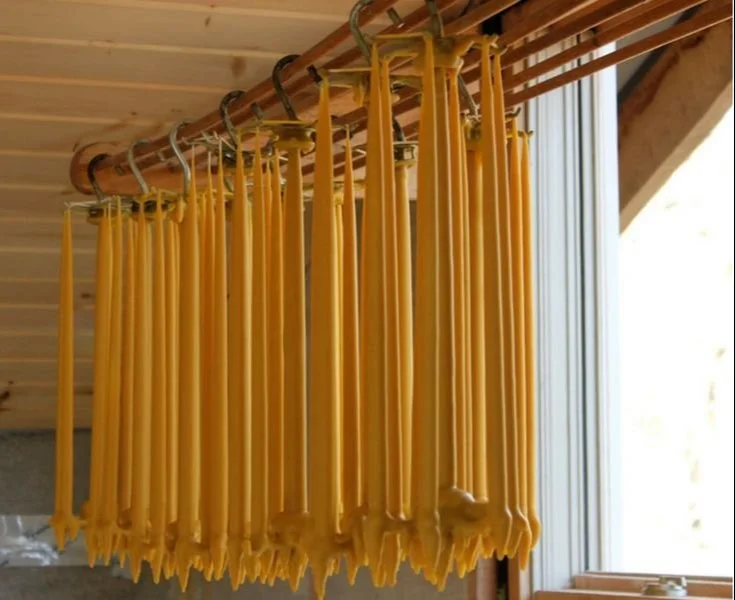 Homemade beeswax candles in cozy evening setting