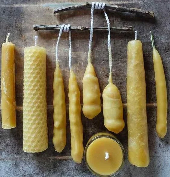 Homemade beeswax candles in varying sizes and shapes, ideal for beginners.
