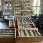 View of soap making process in the studio with essential oils and crafted soaps.