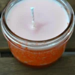 Homemade scented candles in orange creamsicle flavor, perfect for busy moms