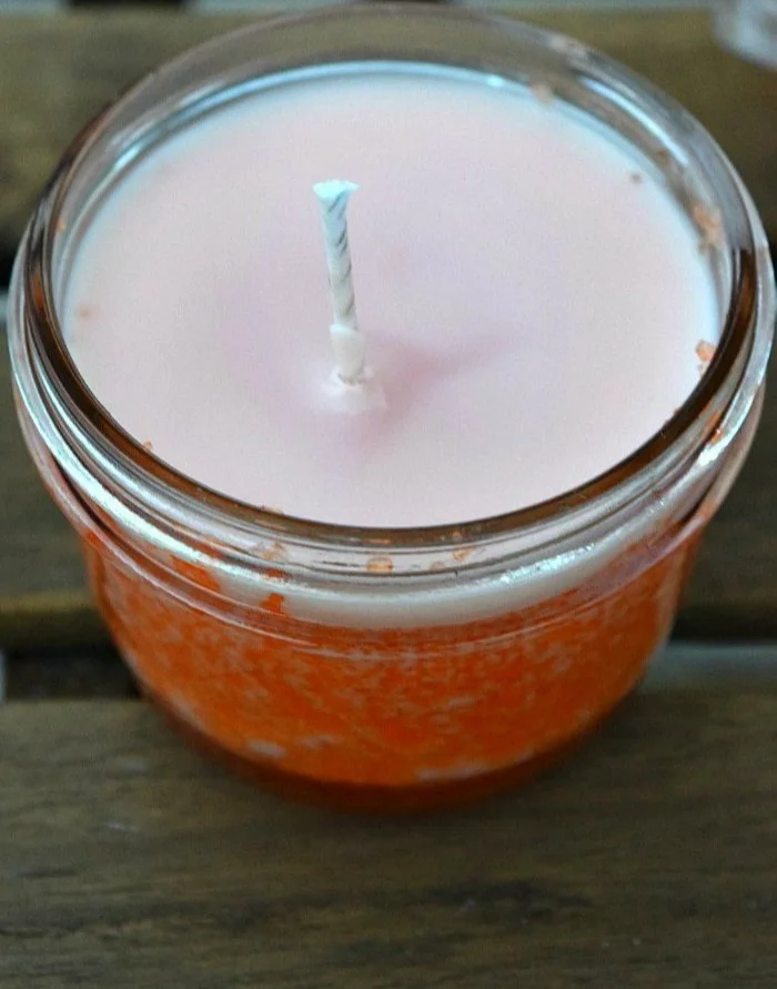 Homemade scented candles in orange creamsicle flavor, perfect for busy moms