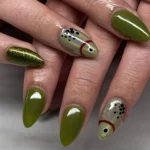 Beautiful green nail art designs showcasing creative styles and patterns.