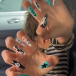 Trendy swag nail designs showcasing Y2K turquoise and black teal nails