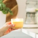 A collection of beautifully crafted homemade candles in various colors and shapes.