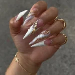 Elegant white and gold stiletto nails design for 2026 inspiration